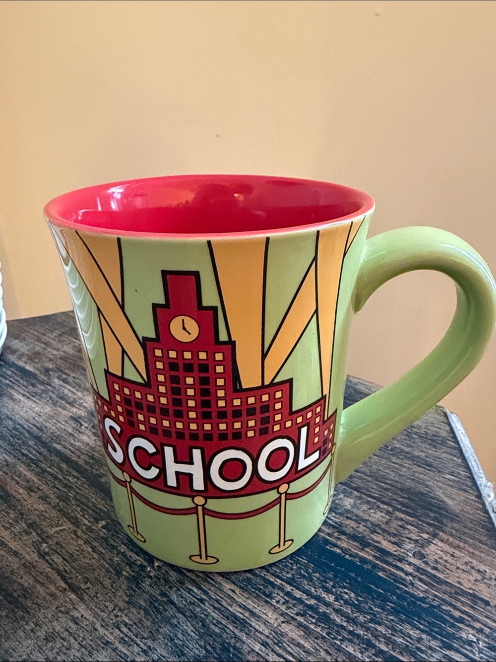 Our name is MUD Graphic Ceramic Mug in Lime Green and RED